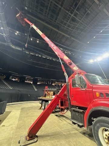 Sentry boom truck on arena floor