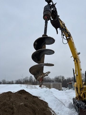 Auger drilling in snow