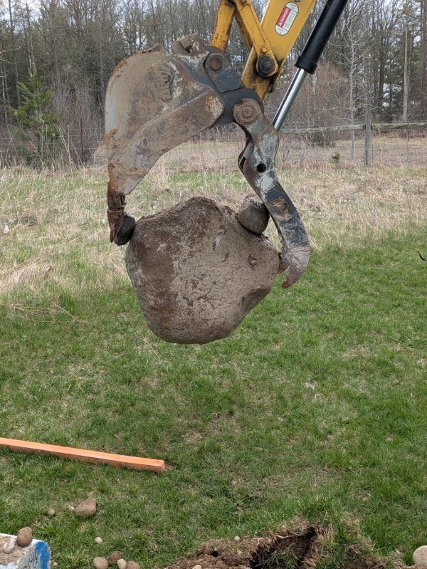 Excavator with rock