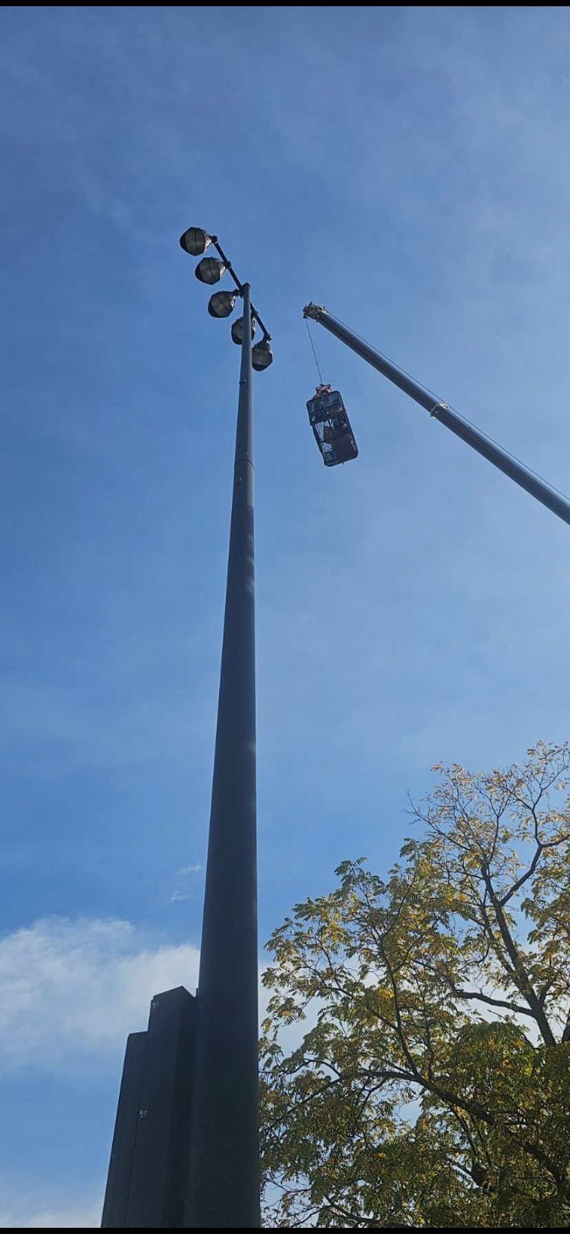 Basket approaching sports light pole